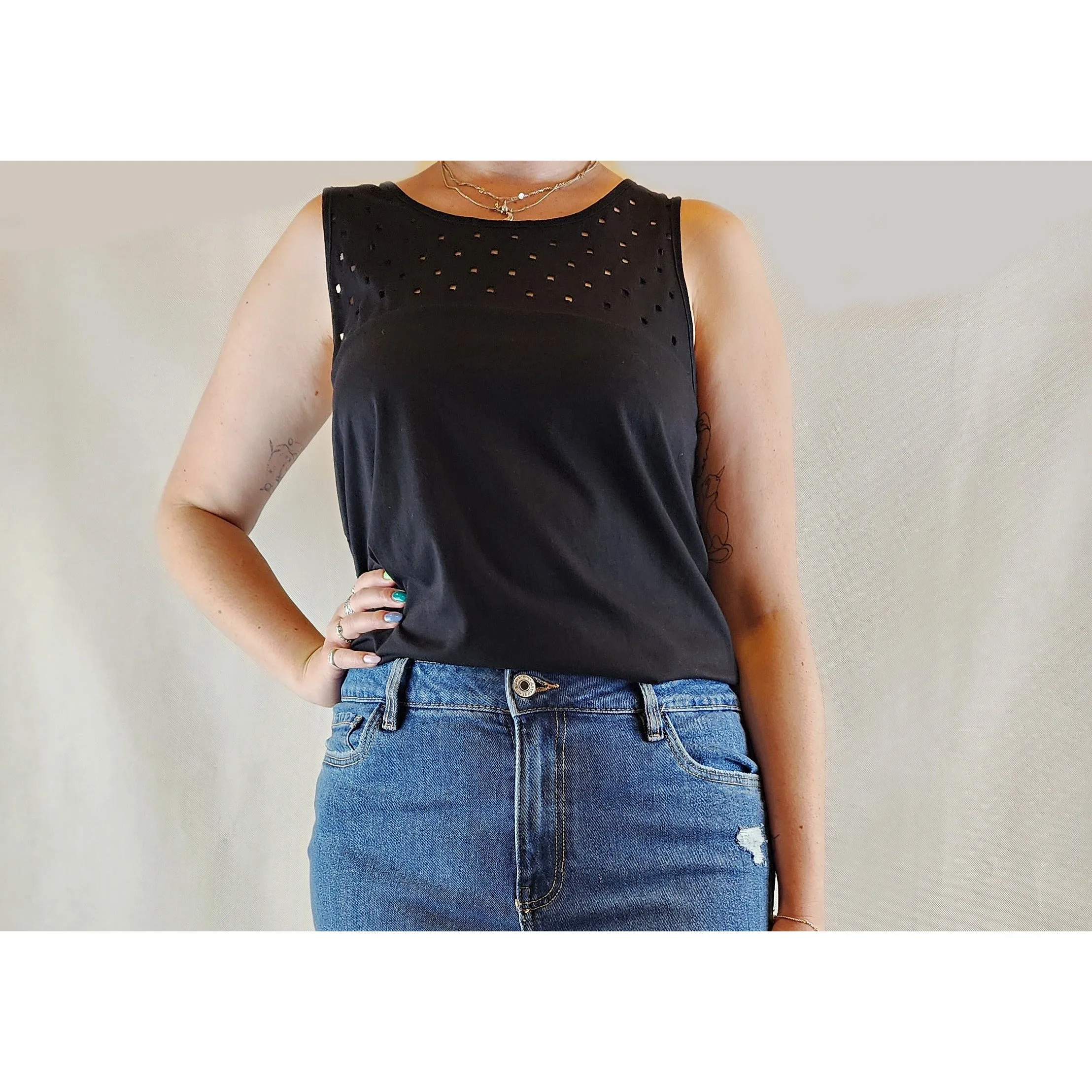 Alpha 60 pre-owned black sleeveless top with perforated squares size M (best fits size 12)